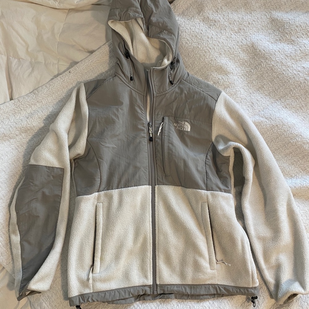 white and gray north face jacket